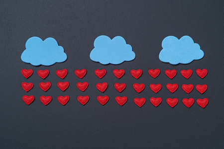 Paper elements in shape of hearts on black background. Symbol of love for Happy Womens, Mothers,...