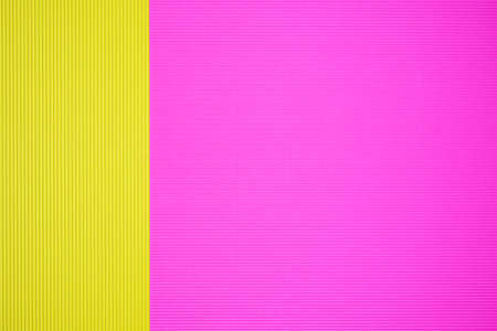 Pink and yellow two tone color paper background with stripes. Abstract background modern hipster futuristic. Texture designの写真素材