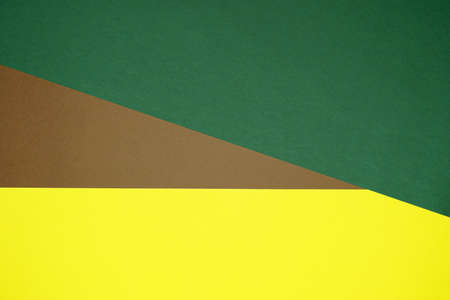 Brown, yellow, green three tone color paper background with stripes. Abstract background modern hipster futuristic. Texture designの写真素材