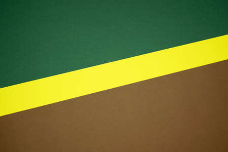 Brown, yellow, green three tone color paper background with stripes. Abstract background modern hipster futuristic. Texture designの写真素材