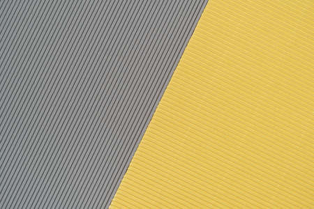 Gray and yellow two tone color paper background with stripes. Abstract background modern hipster futuristic. Texture designの写真素材