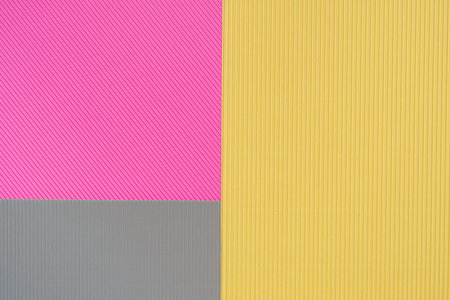 Gray, pink and yellow three tone color paper background with stripes. Abstract background modern hipster futuristic. Texture designの写真素材