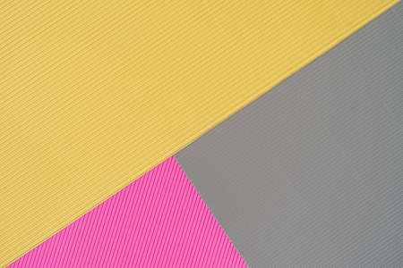 Gray, pink and yellow three tone color paper background with stripes. Abstract background modern hipster futuristic. Texture designの写真素材