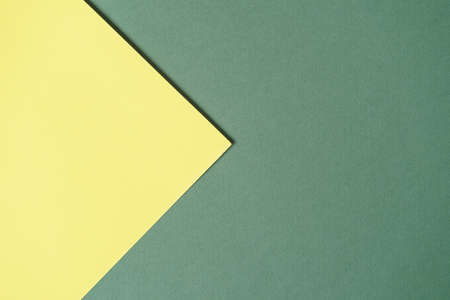 Green and yellow two tone color paper background. Abstract background modern hipster futuristic. Texture designの写真素材