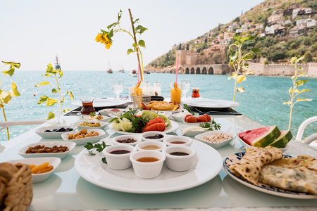 Fresh breakfast in a beautiful location with sea viewsの写真素材
