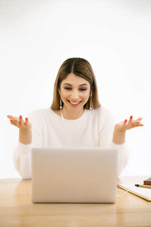 Smiling mixed race lady freelancer, communicating with client via video computer call. Millennial...