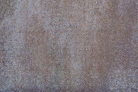 Abstract white rusty metal background. Iron dots texture on outdoor metal wall.の写真素材