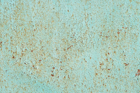 Painted in green old cracked metal rusted background. Metal rust texture. Erosion metal. Scratched...