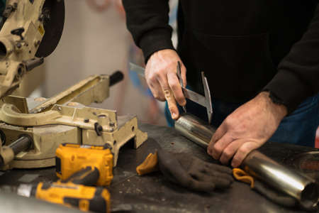 Repairman repair motorcycle, maintenance in garage. Mechanic fixing bike in a modern shop