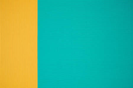 Turquoise and orange two tone color paper background with stripes. Abstract background modern...