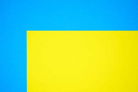 Blue and yellow two tone color paper background with stripes. Abstract background modern hipster futuristic. Texture designの写真素材