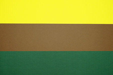 Brown, yellow, green three tone color paper background with stripes. Abstract background modern hipster futuristic. Texture designの写真素材