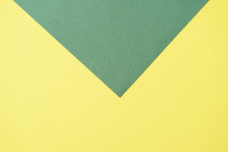Green and yellow two tone color paper background. Abstract background modern hipster futuristic. Texture designの写真素材
