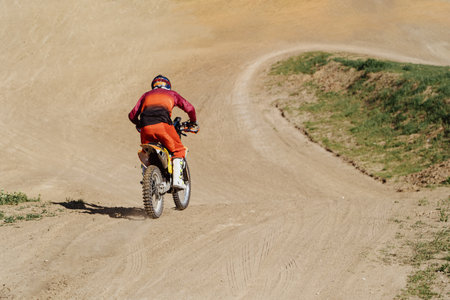 Man riding motorbike on motocross trackの写真素材