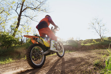 Man riding motorbike on motocross trackの写真素材