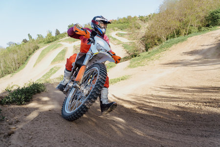 Man riding motorbike on motocross trackの写真素材