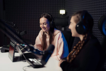 Women speaking during radio program in studio