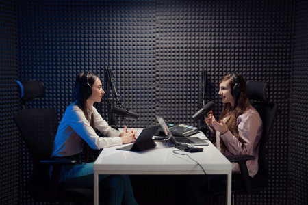 Women talking during podcast recordingの写真素材
