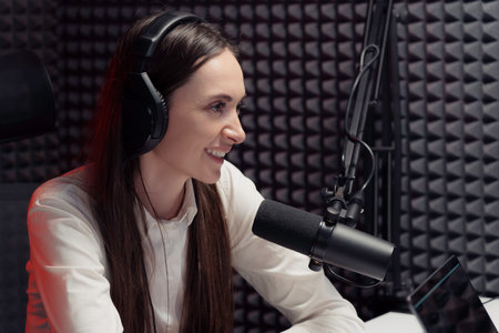 Cheerful woman speaking during radio broadcast