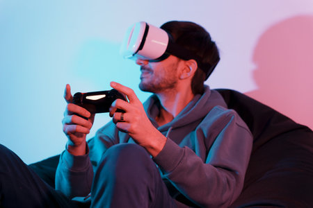 Man playing video game with virtual reality headset