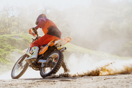 Man riding motorbike on motocross trackの写真素材