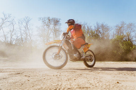 Man riding motorbike on motocross trackの写真素材