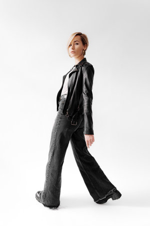 Stylish woman in leather black jacketの写真素材