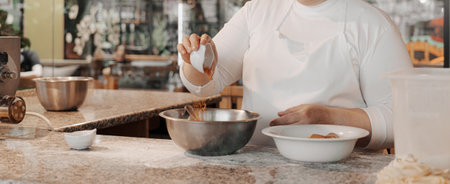 Crop woman adding flour into bowl