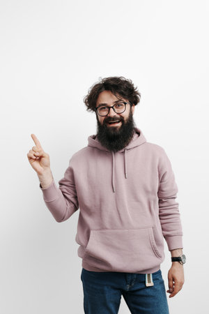 Smiling handsome man wearing pink hoodieの写真素材