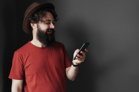 Handsome young man using his phone