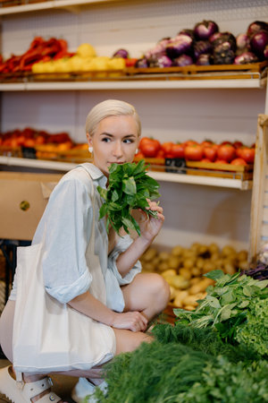 Woman buying fresh herbs