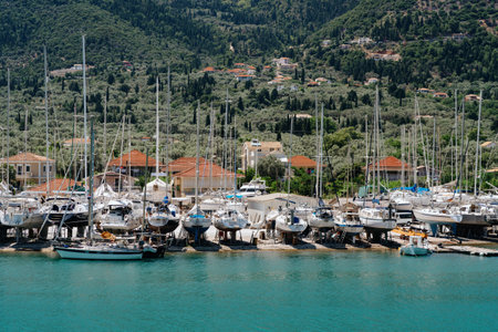 Bustling Marina with Yachts in Mountainous Settingの写真素材