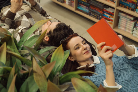 Relaxed couple reading and enjoying time in a bookstore