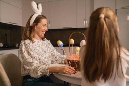 Family enjoying Easter celebration with decorated eggs and festive food at home