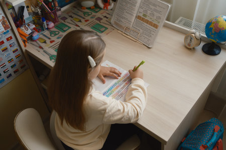 Young student completing homework in a cozy and organized study corner