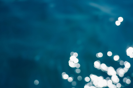 Blue sea water bokeh.の写真素材