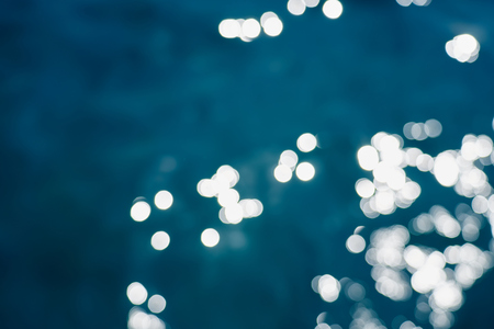Blue sea water bokeh.の写真素材