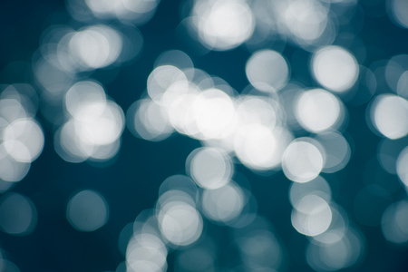 Blue sea water bokeh.の写真素材