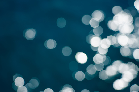 Blue sea water bokeh.の写真素材
