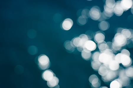 Blue sea water bokeh.の写真素材