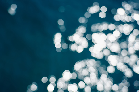Blue sea water bokeh.の写真素材