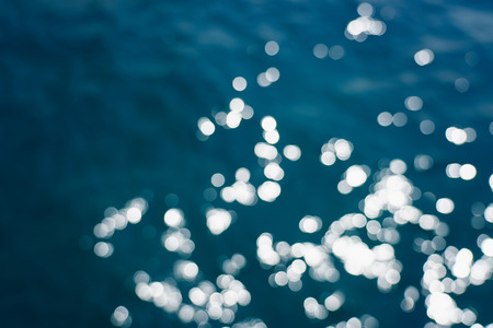 Blue sea water bokeh.の写真素材