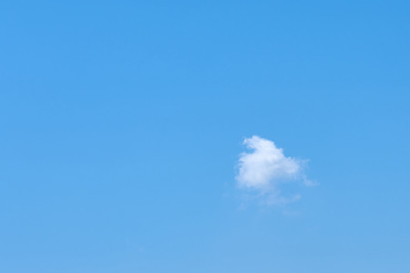 Cloud against a blue sky. Background. Copy space for text.の写真素材