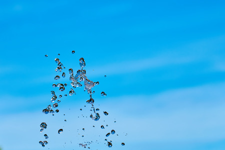 Splash of water against a blue sky. Copy space.の写真素材