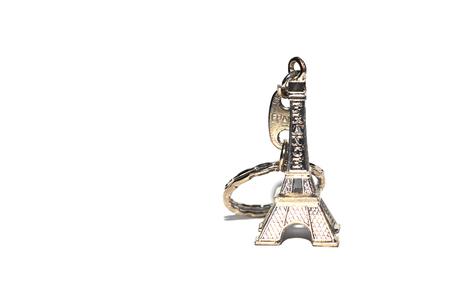 Eiffel tower souvenir keychain isolated on white. Copy space for text.