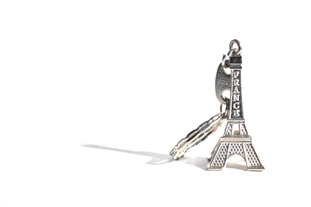 Eiffel tower souvenir keychain isolated on white. Copy space for text.の写真素材