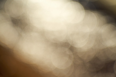 Abstract blurred bokeh of sunlight on water with pastel tone color background.の写真素材