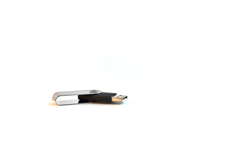 Black USB flash memory with metal cover isolated on a white background.の写真素材