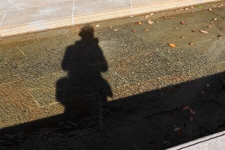 Silhouette of photographer on water.の写真素材