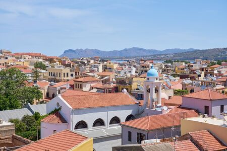 Roofs of Chania, Crete with blue sea and sky on a background.